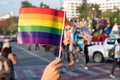 LGBT pride month background. a spectator waves a gay rainbow flag at LGBT gay pride parade festival in Thailand. Royalty Free Stock Photo