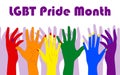 LGBT Pride Month. Hands in the symbolic colors of the rainbow.
