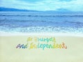 LGBT Pride rainbow color on the beach. Pride text quotation with LGBTQ rainbow colors.
