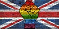 LGBT Protest Fist on a United Kingdom brick Wall Flag Royalty Free Stock Photo