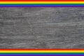 LGBT rainbow flag text frame banner isolated on gray wooden background