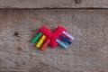 LGBT rainbow knitted heart symbol of love on wooden background, concept Royalty Free Stock Photo