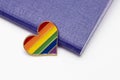 Lgbt rights and searching for asylum and migration concept, and rainbow gay pride symbol heart and blue passport on white Royalty Free Stock Photo