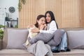 LGBT, Two beautiful scared girls watching horror movie at living room. Royalty Free Stock Photo
