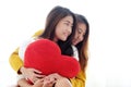 LGBT, Young cute asia lesbians huging and holding red heart shape willow together with happy smiling, couple