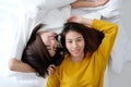 LGBT, Young cute asia lesbians lying and smiling on white bed to