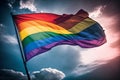 LGBTQ flag waving in the wind at cloudy sky