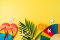 LGBTQ pride month beach party border background with rainbow flip flops and paper fan. Top view, flat lay