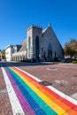 LGBTQ rainbow depicted on a street crosswalk in Gainesville Florida on a sunny day