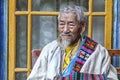 Tibetan Pilgrim inside the Jokhang Temple in Lhasa, Tibet. It is one of the famous Buddhist monasteries in Lhasa Royalty Free Stock Photo