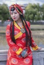 Unidentified Chinese model with Tibetan jewelry in front of Potala Palace in Lhasa