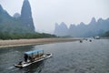 Li river beautiful view of many hills and cruise ships Royalty Free Stock Photo