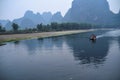 Li river beautiful view of many hills and cruise ships Royalty Free Stock Photo