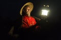 Li River - Xingping, China. Circa January 2016 - A fisherman gets his lamp ready to go out fishing at night.