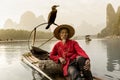 Li River - Xingping, China. Circa January 2016 - A fisherman take a rest before going fishing at night.