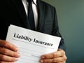 Liability Insurance policy in the hands. Royalty Free Stock Photo