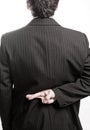 Liar business man with crossed fingers Royalty Free Stock Photo
