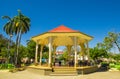 LIBERIA, COSTA RICA, JUNE, 21, 2018: Outdoor view of people resting inside of a building in the middle of the park in