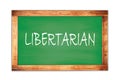 LIBERTARIAN text written on green school board