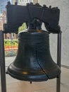 Liberty Bell in Philadelphia with flowers and buildings in the background Royalty Free Stock Photo