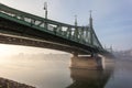The Liberty Bridge in Budapest in Hungary, it connects Buda and Pest cities across the Danube river Royalty Free Stock Photo