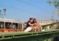 Liberty bridge in Budapest - young girls sitting at bridge structures