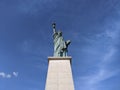 Liberty Statue under a blue sky