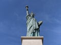 Liberty Statue under a blue sky
