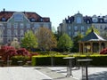 Liberty style buildings seen from a city garden to Munich in Germany.