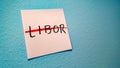 Libor, short for London Interbank Offered Rate on a sticky note crossed with a red pen for its replacement by risk free rates