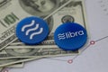 Libra blue cryptocyrrency coin lie on table