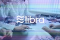 Libra cryptocurrency sign. The concept of business, cryptocurrency and finance - a team of businessmen are sitting in an office at