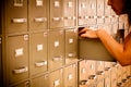 Librarian checking index cards Royalty Free Stock Photo