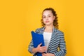 Library assistant. Happy girl hold library folder. School library. Knowledge and information. Student teen formal style