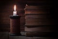 Library background, old books and candle on wooden table, education and literature concept, vintage style Royalty Free Stock Photo