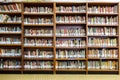 Library with book shelves full of book arranged in order on regals