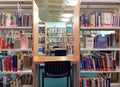 Library books on shelves and study area.