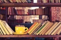 Library bookshelf and yellow cup - Old fashioned style