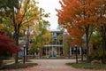 library building viewed between autumncolored trees Royalty Free Stock Photo