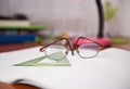 Library desk with books, glasses ,and drawing tool Royalty Free Stock Photo