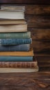 Library essentials stack of books over wooden table for education