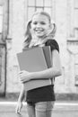 Library of her dreams. Cute library reader. Small child go to library. Adorable little girl borrow books from school Royalty Free Stock Photo