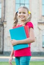 Library of her dreams. Cute library reader. Small child go to library. Adorable little girl borrow books from school Royalty Free Stock Photo