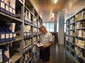 Shenzhen, China: library, male and female readers are reading