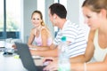 In the library - pretty female student with books Royalty Free Stock Photo