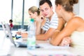 In the library - pretty female student with books Royalty Free Stock Photo