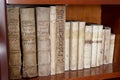 Library shelves with ancient religious books from the 1500s