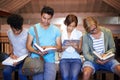 Library, students and high school group with studying, people and books for development at academy. Teenager friends Royalty Free Stock Photo
