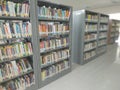 library textbooks, books arranged on library shelves