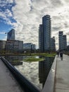 Library of trees, new Milan park. Solaria tower, Diamond tower. Skyscrapers mirrored in the fountain. Italy